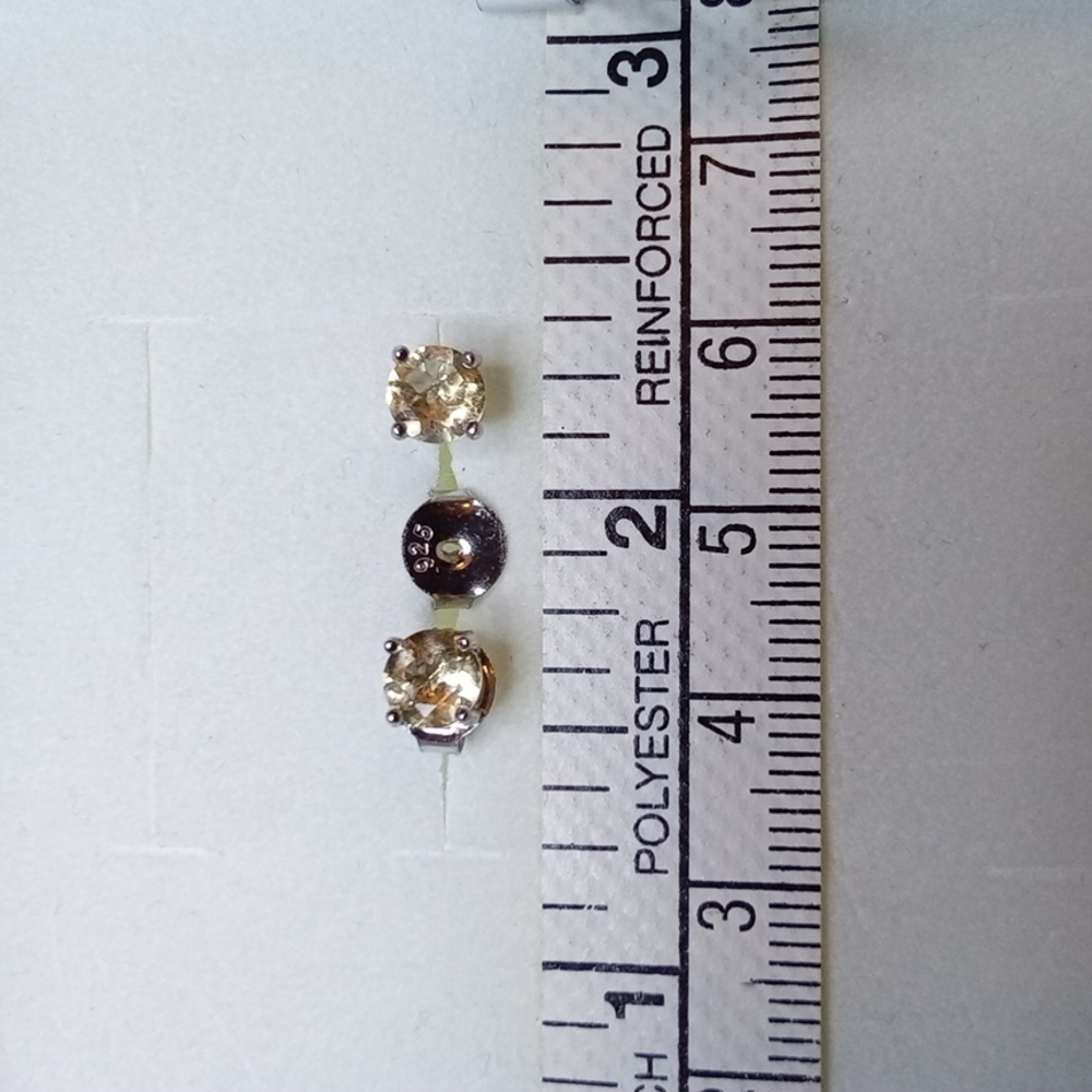 Citrine, Novembers birthstone..8 Ctw. faceted round cut,set in Sterling silver.